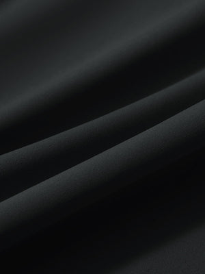 Close-up texture of black women's lightweight athletic sweatpants fabric showing weave detail.