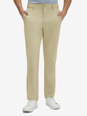 Front lower body shot of model wearing khaki straight fit lightweight dress golf pants