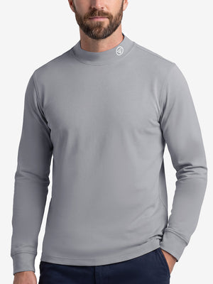 Upper body front view of model wearing grey warm brushed mock neck golf t shirt