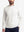 Upper body front view of model wearing beige warm brushed mock neck golf t shirt