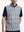 Front upper body shot of model wearing black grey leaf1 full print quarter zip sleeveless vest pullover
