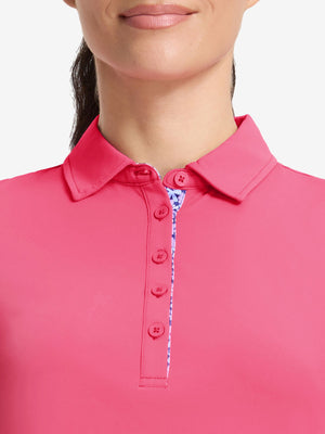 Front shot from nose to chest of model wearing rose women's 5 buttons collared polo shirts