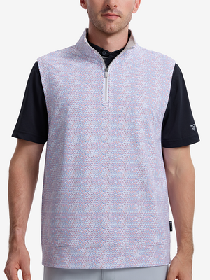 Front upper body shot of model wearing colorful hexagon full print quarter zip sleeveless vest pullover