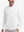 Front upper body shot of model wearing white solid stretch cotton pique long sleeve polo shirts