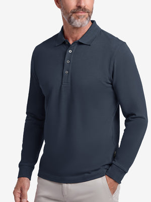 Front upper body shot of model wearing navy solid stretch cotton pique long sleeve polo shirts
