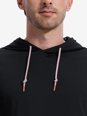 Close-up front view from nose to chest of model wearing black soft stretchy hoodie with inner print hood