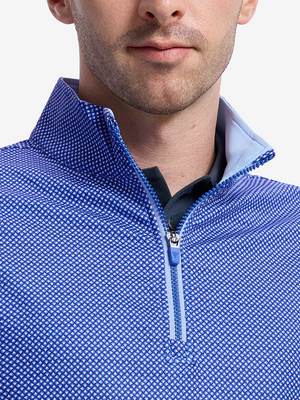 Close-up front view from nose to chest of model wearing cobalt wave full print quarter zip sleeveless vest pullover
