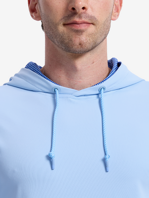 Close-up front view from nose to chest of model wearing light blue soft stretchy hoodie with inner print hood