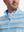 Close-up front view from nose to chest of model wearing blue ethnic  full print quarter zip sleeveless vest pullover