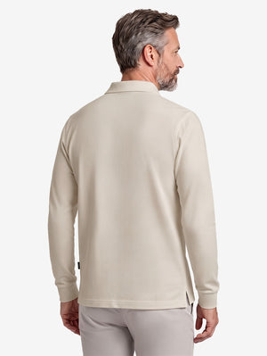Back upper body shot of model wearing light khaki solid stretch cotton pique long sleeve polo shirts