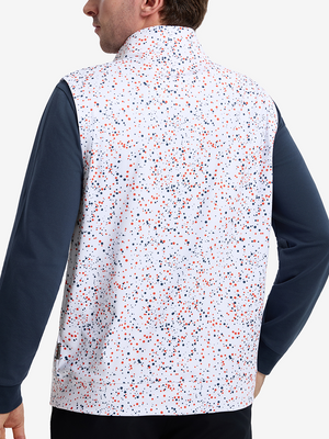 Back upper body shot of model wearing white polka dots full print quarter zip sleeveless vest pullover