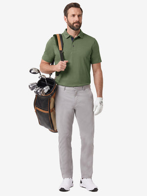 Front full body shot of model wearing green grey ultra-comfort slim fit roma knit polo shirts with golf bag on back
