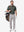 Front full body shot of model wearing grey ultra-comfort slim fit roma knit polo shirts with golf bag on back
