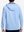 Back view of model showcasing light blue soft stretchy hoodie with inner print hood