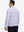 Back upper body view of the lightweight print polo in white painting, model turns slightly with relaxed pose.
