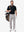 Front full body shot of model wearing navy  ultra-comfort slim fit roma knit polo shirts with golf bag on back