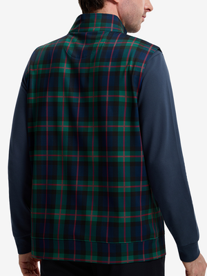 Back upper body shot of model wearing dark plaid  full print quarter zip sleeveless vest pullover