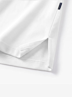 Detail view of hem on white solid stretch cotton pique long sleeve polo shirts