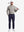 Front full body shot of model wearing sand warm brushed mock neck golf t shirt with golf club resting on shoulder