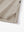 Detail view of hem on light khaki solid stretch cotton pique long sleeve polo shirts