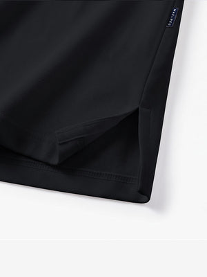 Detail view of hem on black solid stretch cotton pique long sleeve polo shirts