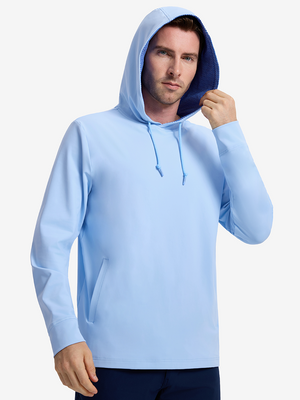Front upper body shot of model wearing light blue soft stretchy hoodie with inner print hood and pulling the hood with one hand
