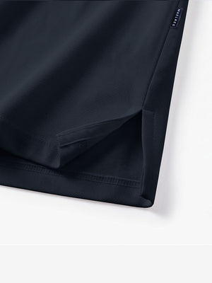 Detail view of hem on dark navy solid stretch cotton pique long sleeve polo shirts