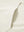 Close-up of single pocket detail on youth long sleeve hoodied with kangaroo pocket in cream, showing stitching.