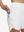 Side view of pocket on white women's high waist 2 in 1 quick dry shorts with 7 pockets