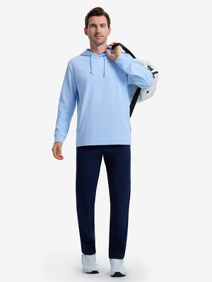 Front full body shot of model wearing light blue soft stretchy hoodie with inner print hood while carrying a golf bag on back