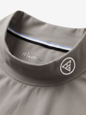 Collar detail close-up in sand warm brushed mock neck golf t shirt