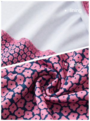 Close-up view of red navy flower   full print quarter zip sleeveless vest pullover showing inner lining and outer fabric  details