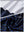 Close-up view of navy flower   full print quarter zip sleeveless vest pullover showing inner lining and outer fabric  details