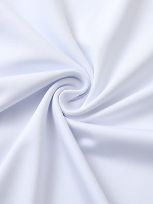 Close-up of white premium performance polo fabric showing smooth texture.