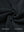 Close-up fabric detail of soft winter fleece jackets, plush texture with warm feel in black