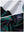 Close-up view of dark plaid   full print quarter zip sleeveless vest pullover showing inner lining and outer fabric  details