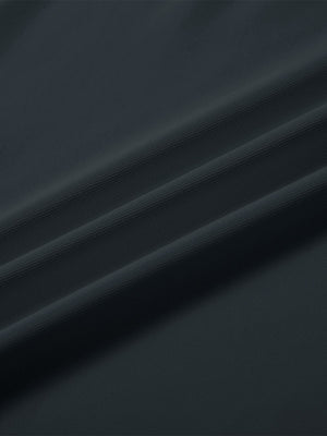 Close-up texture of  dark gray solid stretch cotton pique long sleeve polo shirts fabric showing detailed premium material and weave