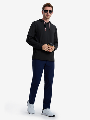 Front full body shot of model wearing black soft stretchy hoodie with inner print hood while holding a coffee cup with both hands