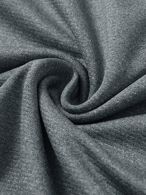 Close-up texture of  grey melange lightweight sleeveless quarter zip golf vest fabric showing detailed premium material and weave