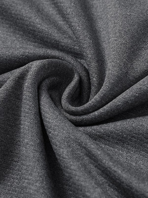 Close-up texture of  black melange lightweight sleeveless quarter zip golf vest fabric showing detailed premium material and weave