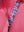 Detail view of collar and buttons on rose women's 5 buttons collared polo shirts