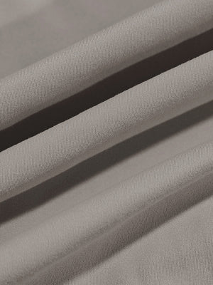 Close-up texture of  sand warm brushed mock neck golf t shirt fabric showing detailed premium material and weave
