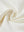 Close-up texture of  cream soft stretchy hoodie with inner print hood fabric showing detailed premium material and weave