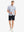 Full-body front view holding a takeaway drink cup, wearing WHITE SAND PINEAPPLE Stylish Printing Summer Shirt.